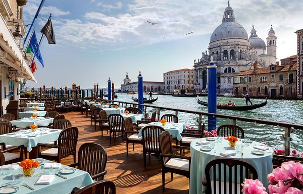 Canal-side dining looks romantic, but restaurants in these areas tend to be overpriced and serve tourist-friendly (read: bland) menus. For authentic Venetian flavors, venture into local neighborhoods like Santa Croce, where you’ll taste real, delicious food without the tourist markup.