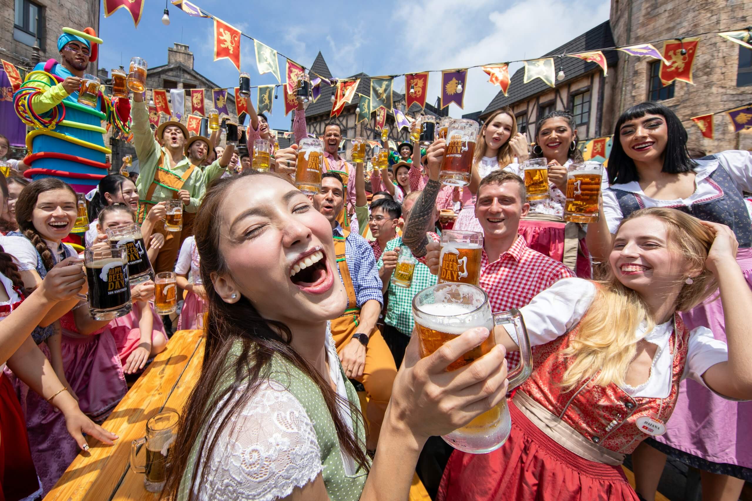 Friends celebrating and drinking beer at Munich Oktoberfest